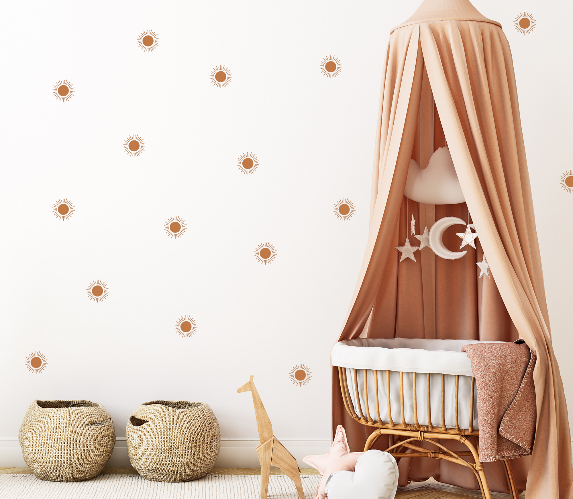 neutral nursery with terracotta sun wall decals behind a rattan crib
