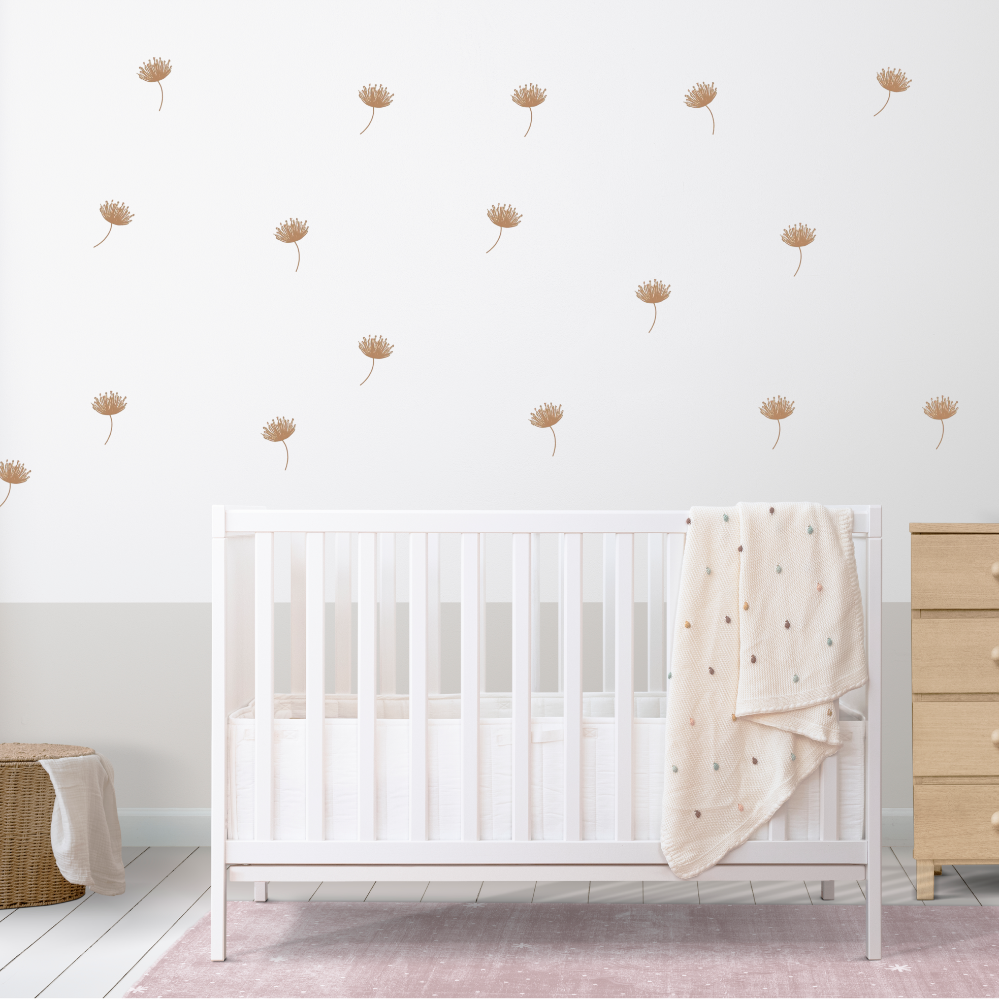 boho kids room with scattered beige flower stickers on the wall behind crib and dresser