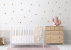 close-up of beige meadow bloom wall decals styled in a minimalist nursery