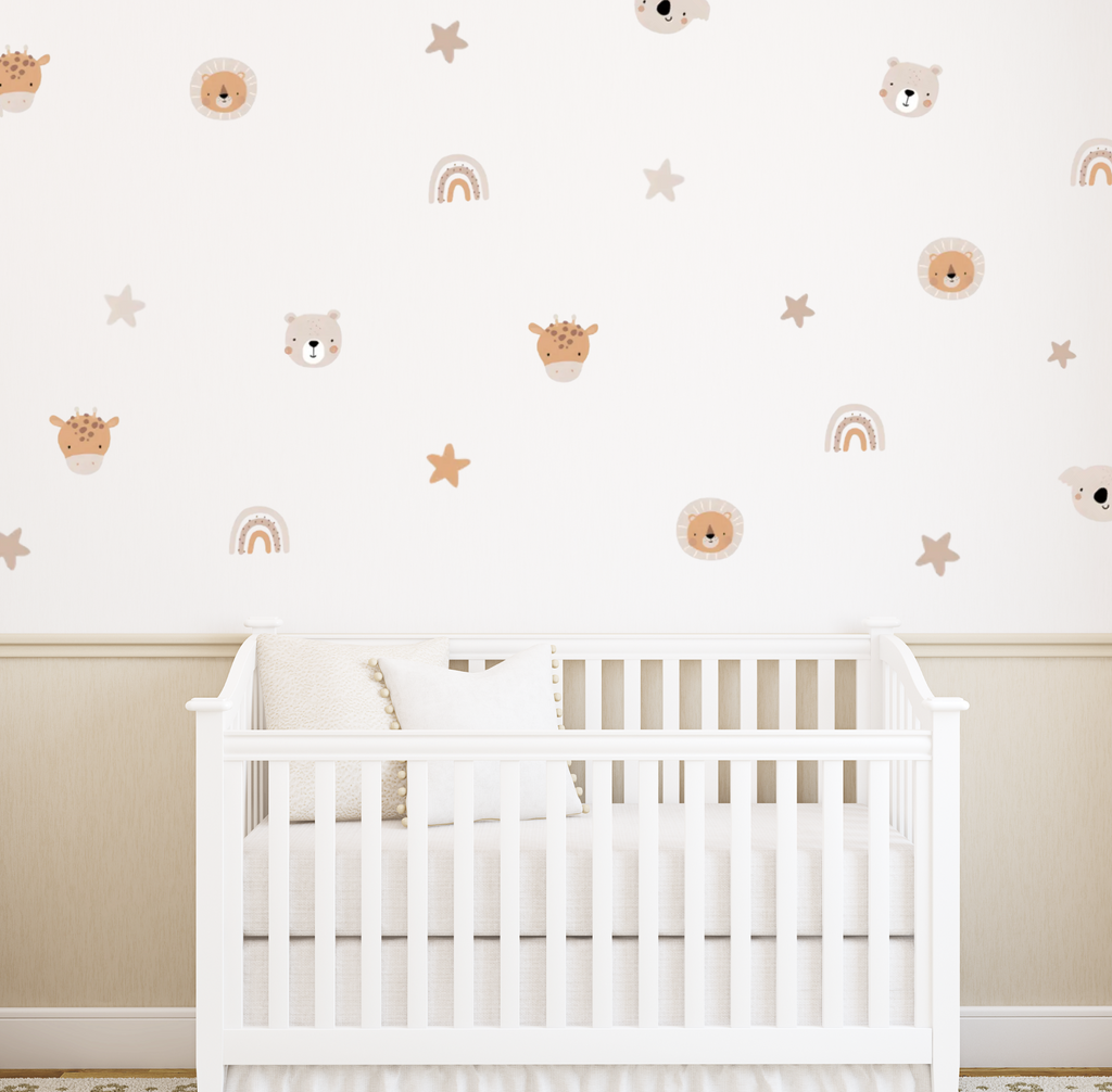 Safari-themed wall decals including lions, bears, rainbows and stars arranged above a white crib in a neutral nursery